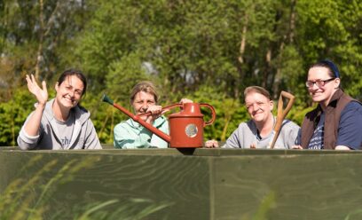 Group of people with a watering can
